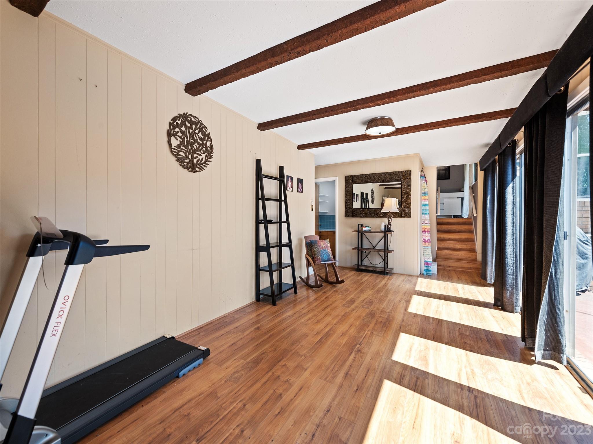 69 Patton Cemetery Road Swannanoa, NC 28778 - Photo 21 of 35 a view of a room with wooden floor and stairs