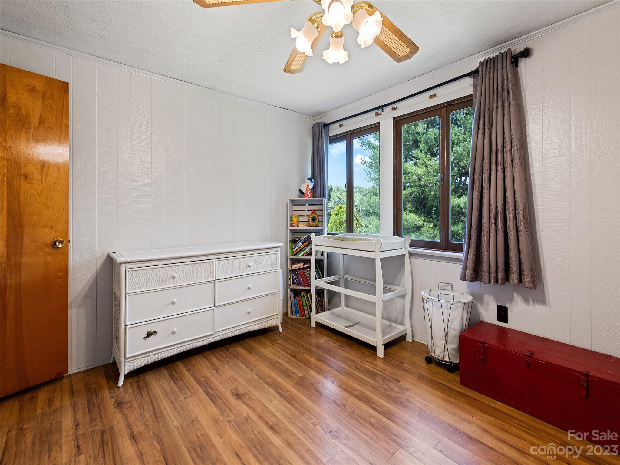 69 Patton Cemetery Road Swannanoa, NC 28778 - Photo 23 of 35 a bed room with a bed and a window