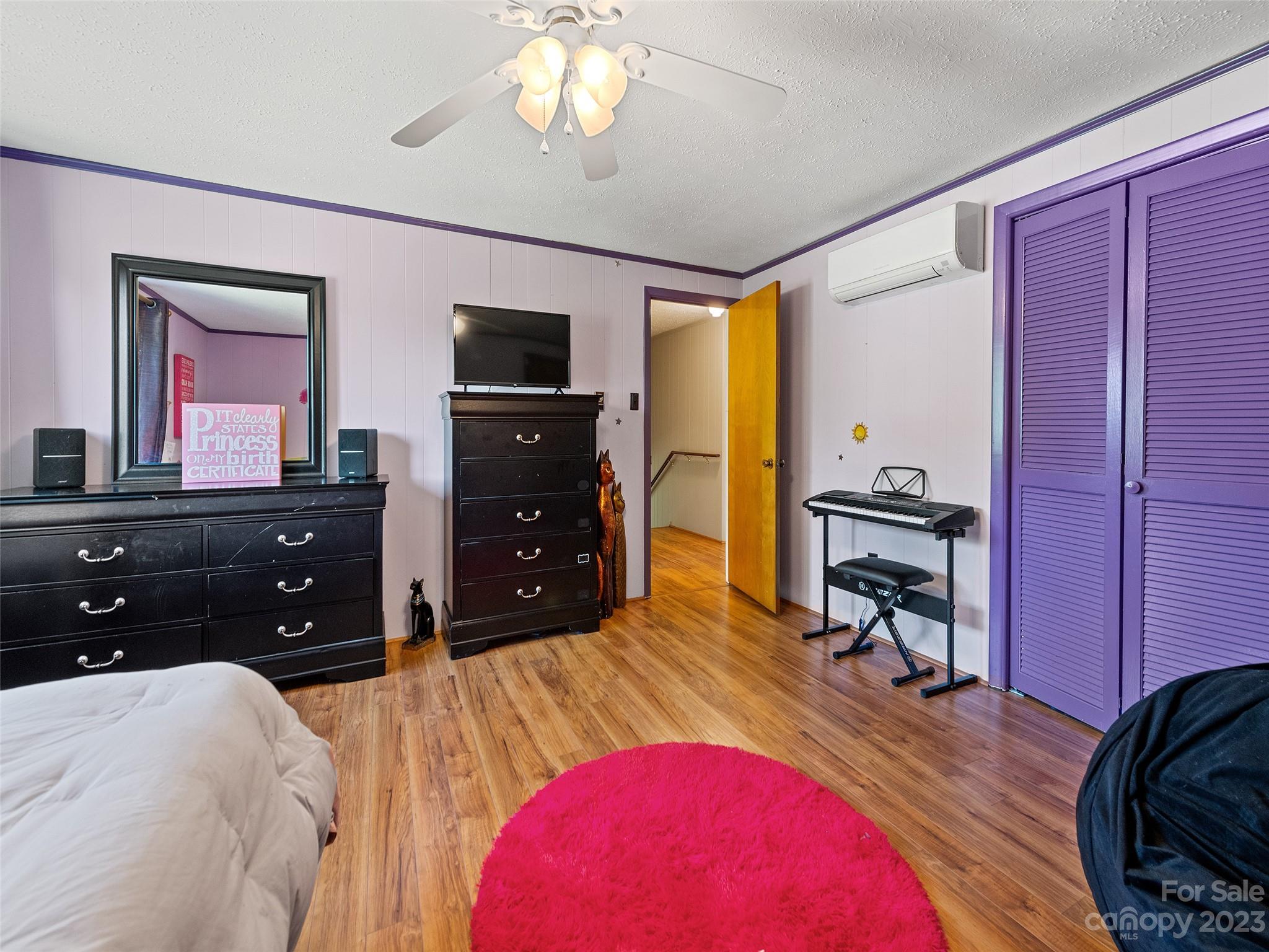 69 Patton Cemetery Road Swannanoa, NC 28778 - Photo 26 of 35 a bed room with a bed and a television