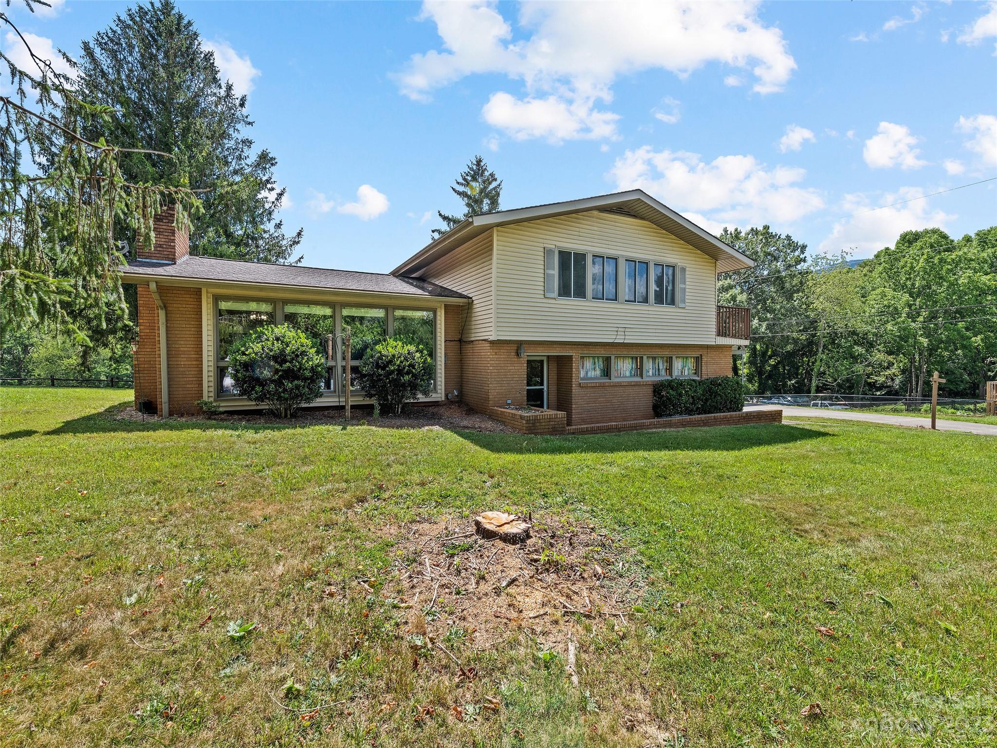 69 Patton Cemetery Road Swannanoa, NC 28778 - Photo 3 of 35 a view of house that has a yard