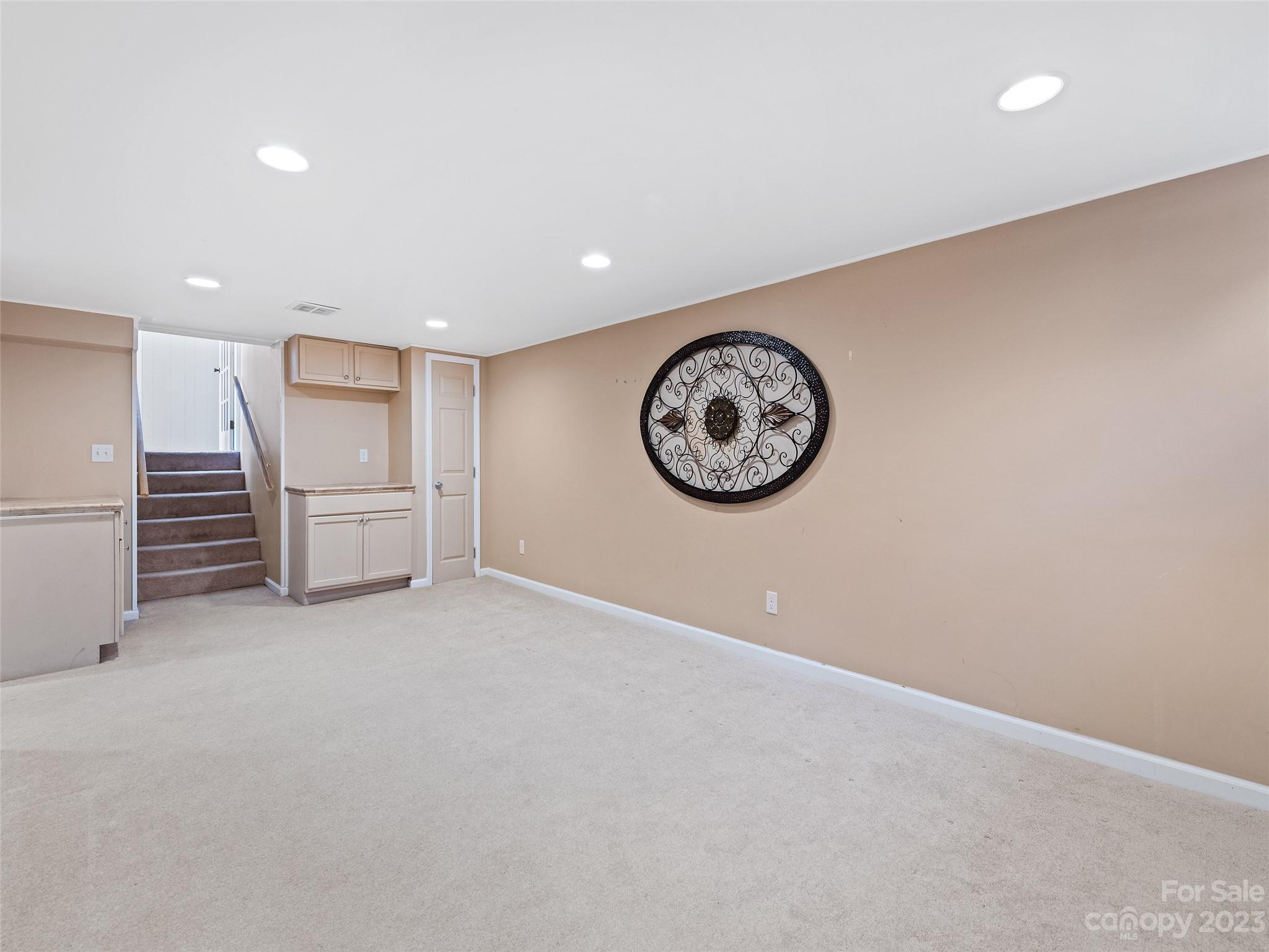 69 Patton Cemetery Road Swannanoa, NC 28778 - Photo 32 of 35 a view of a room with an entryway and a refrigerator