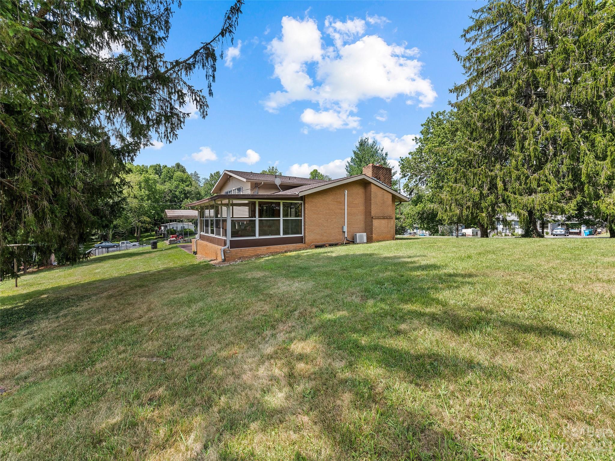69 Patton Cemetery Road Swannanoa, NC 28778 - Photo 4 of 35 a view of a house with a yard
