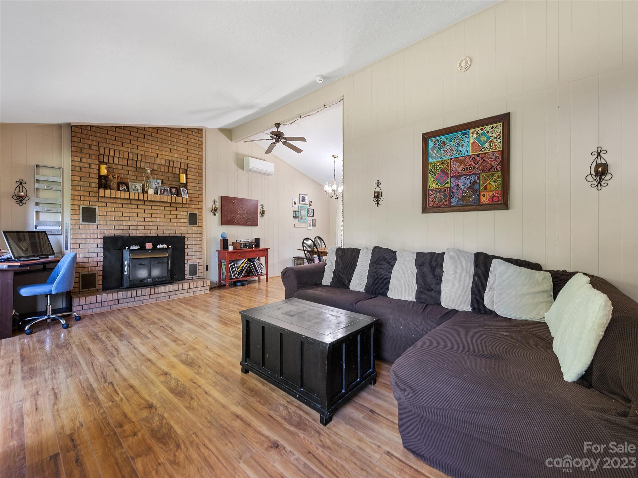 69 Patton Cemetery Road Swannanoa, NC 28778 - Photo 9 of 35 a living room with furniture and a fireplace
