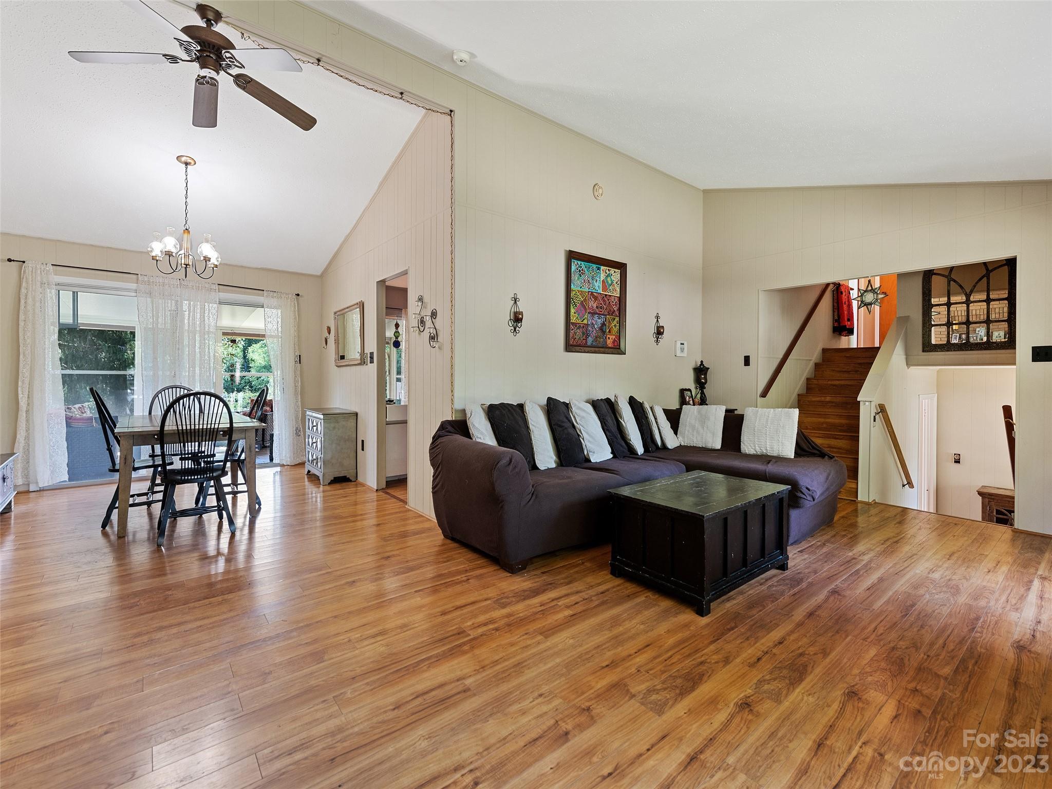 69 Patton Cemetery Road Swannanoa, NC 28778 - Photo 10 of 35 a living room with furniture and a wooden floor