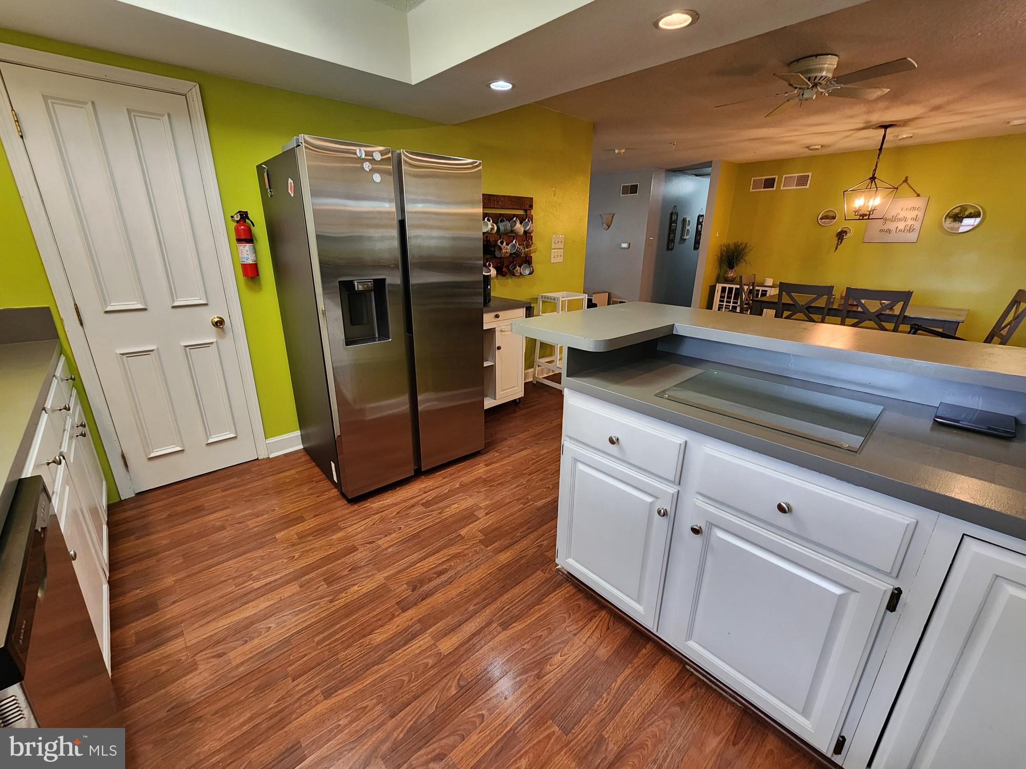 87 Summers Street Inwood, WV 25428 - Photo 11 of 41 a kitchen with stainless steel appliances a refrigerator and a stove
