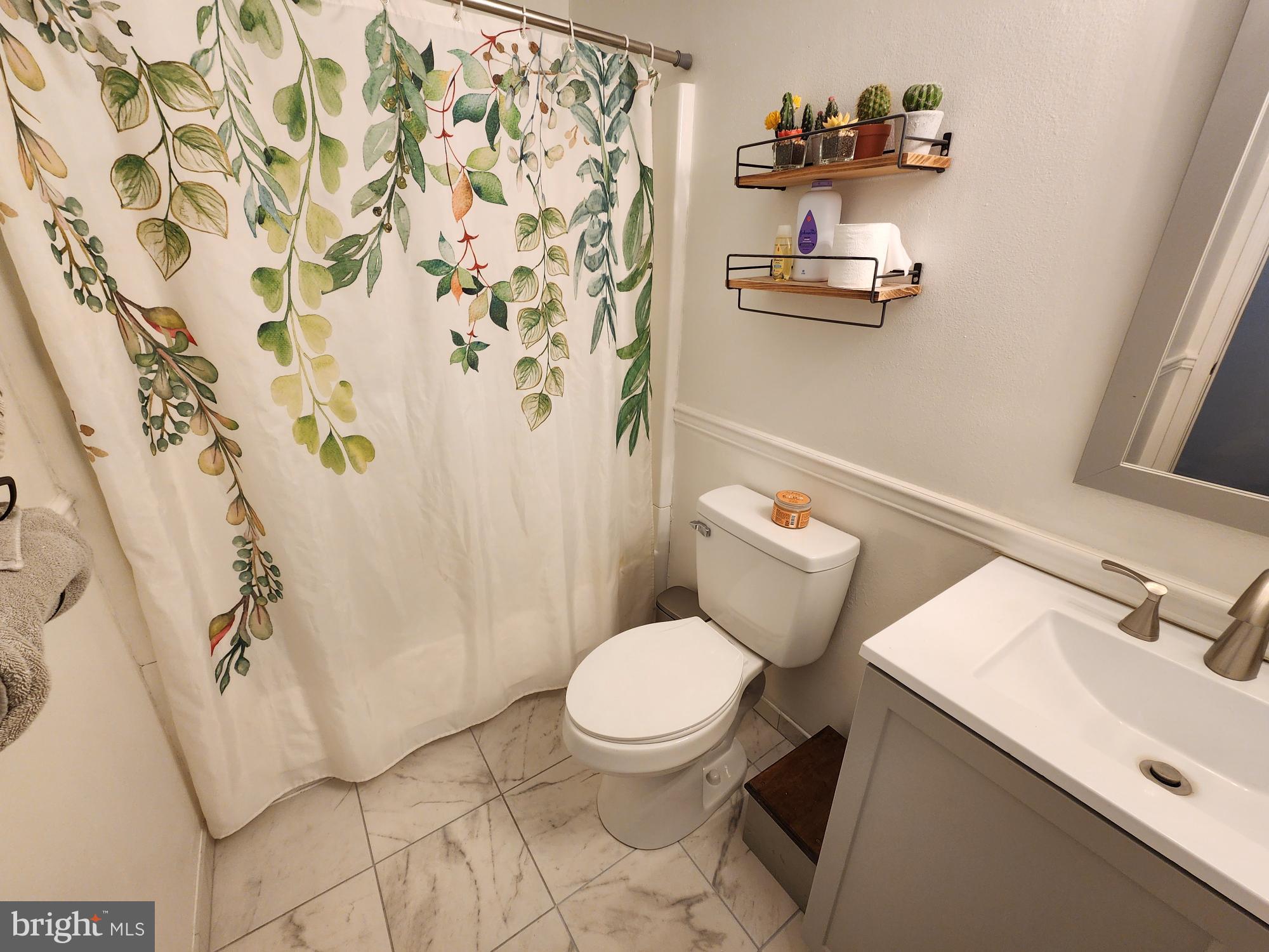 87 Summers Street Inwood, WV 25428 - Photo 17 of 41 a bathroom with a sink toilet and shower
