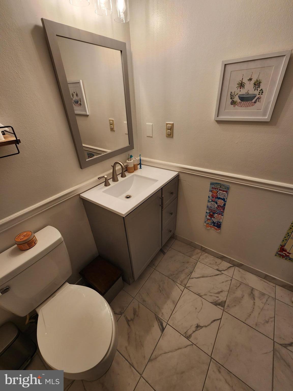 87 Summers Street Inwood, WV 25428 - Photo 18 of 41 a bathroom with a toilet a sink and mirror