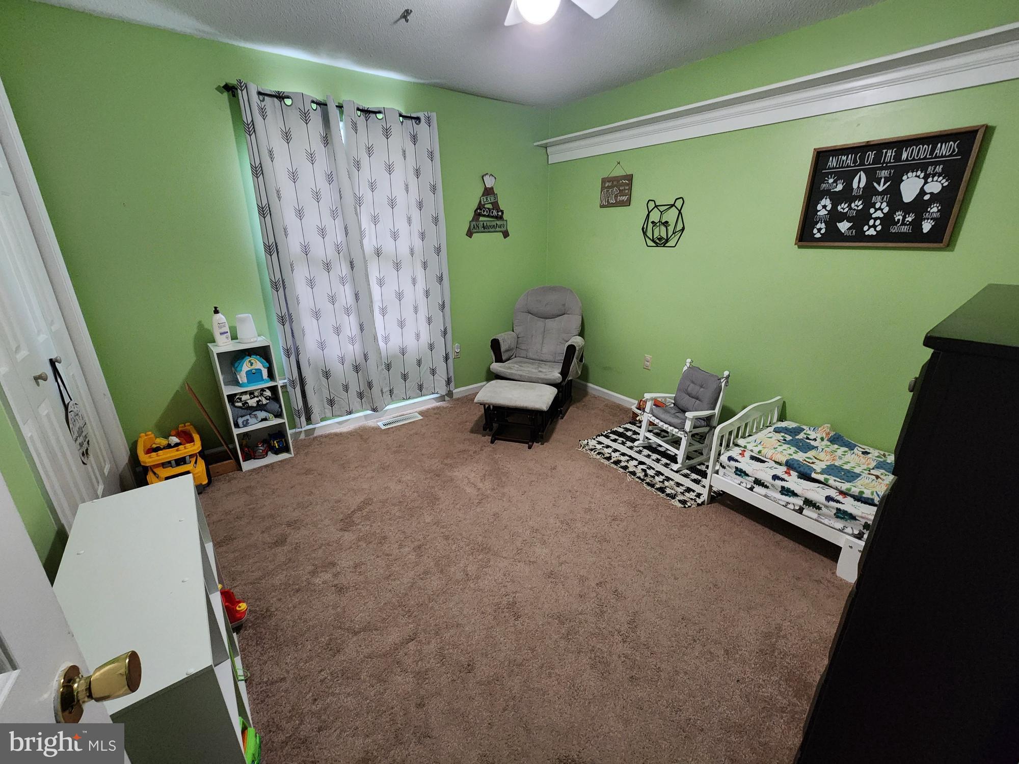 87 Summers Street Inwood, WV 25428 - Photo 20 of 41 a living room with furniture and a window