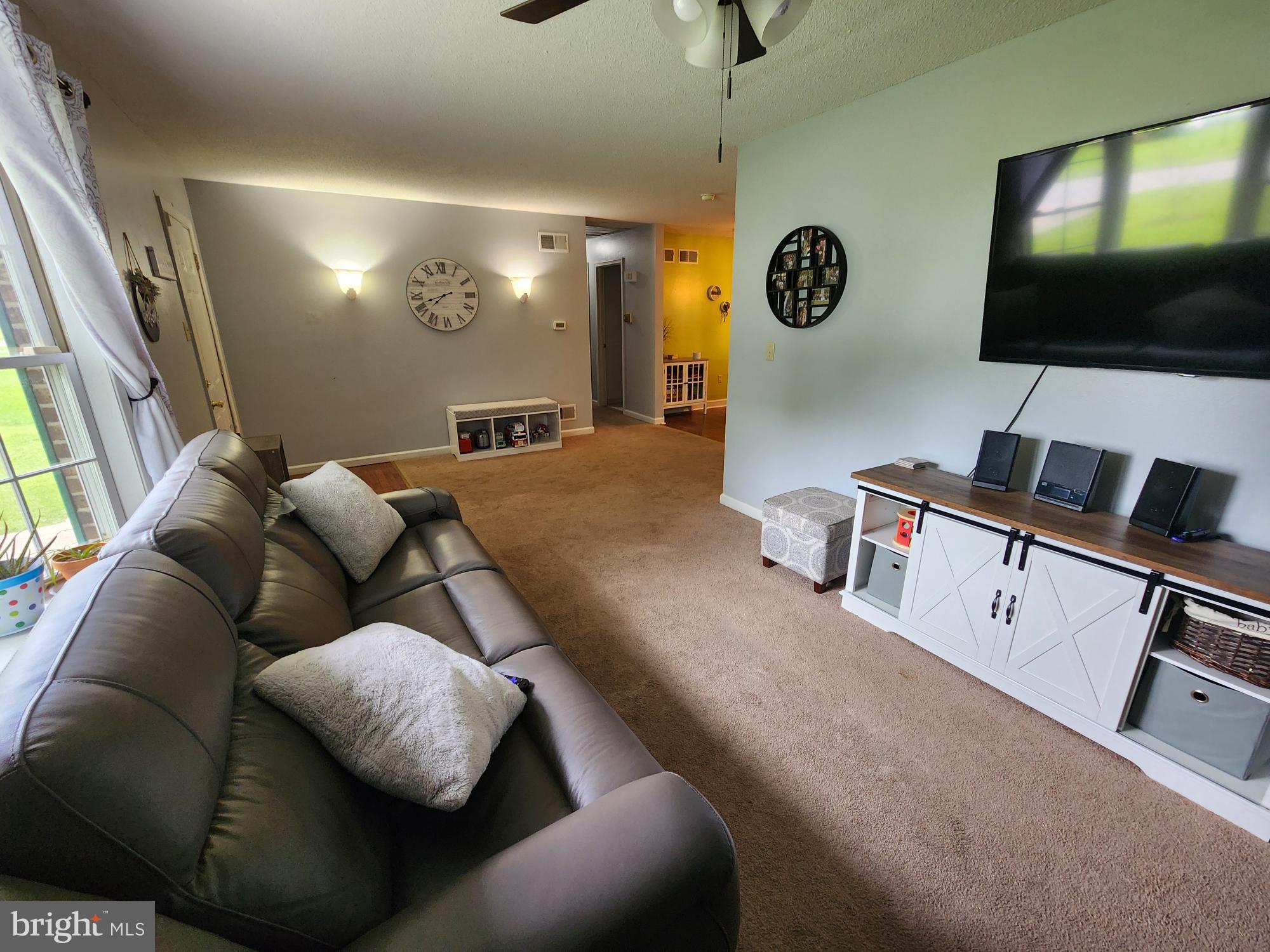 87 Summers Street Inwood, WV 25428 - Photo 4 of 41 a living room with furniture and a flat screen tv