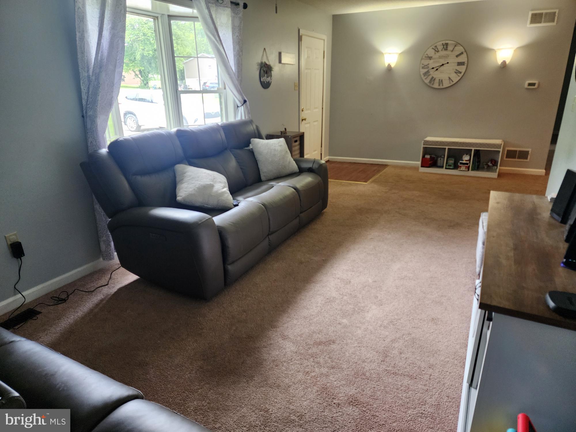 87 Summers Street Inwood, WV 25428 - Photo 6 of 41 a living room with furniture and a window