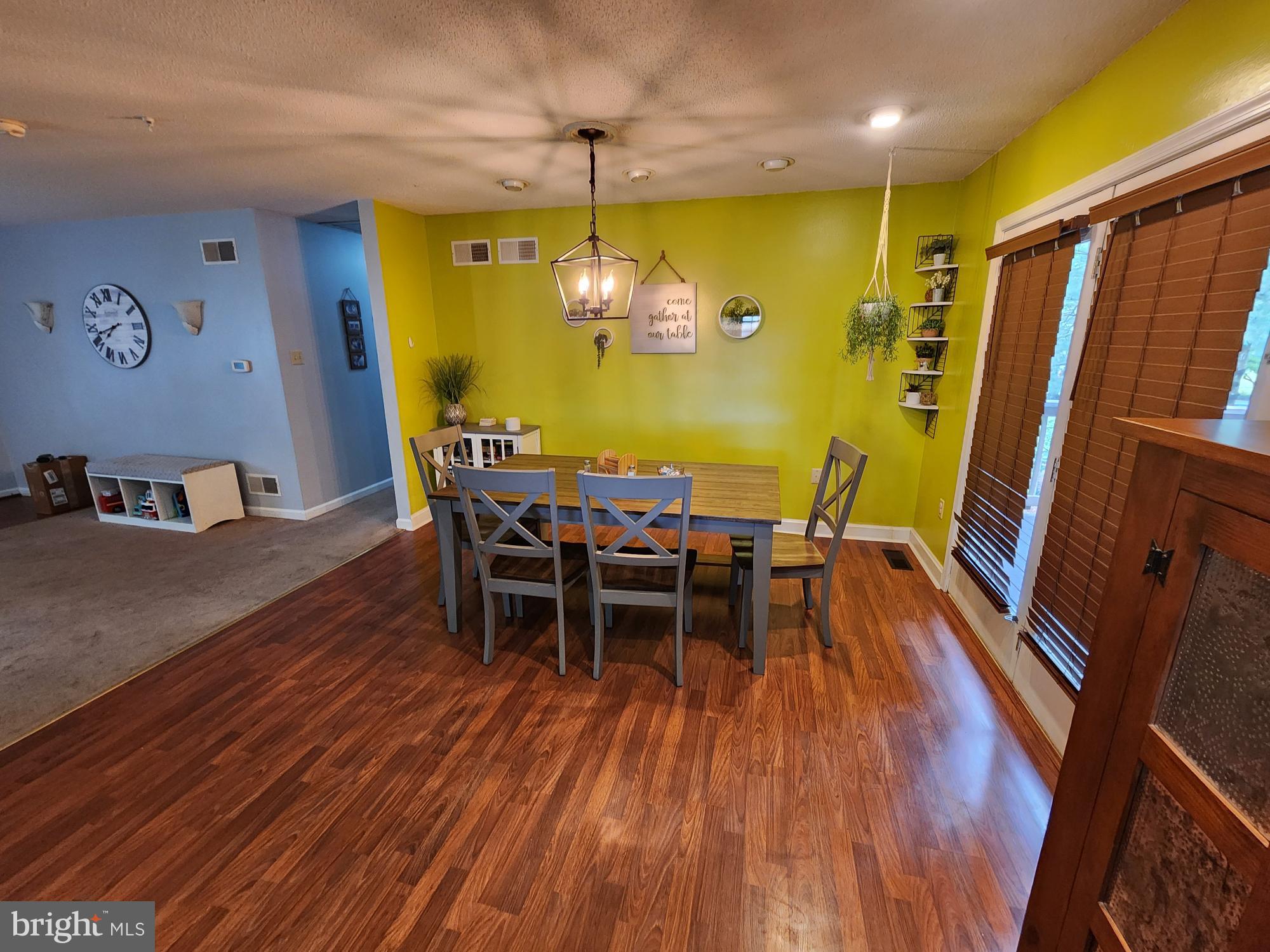87 Summers Street Inwood, WV 25428 - Photo 7 of 41 a view of a dining room with furniture and chandelier