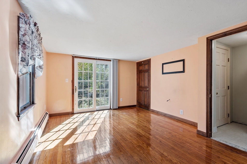 4 Moran Street Gardner, MA 01440 - Photo 11 of 30 a view of a room with wooden floor and windows