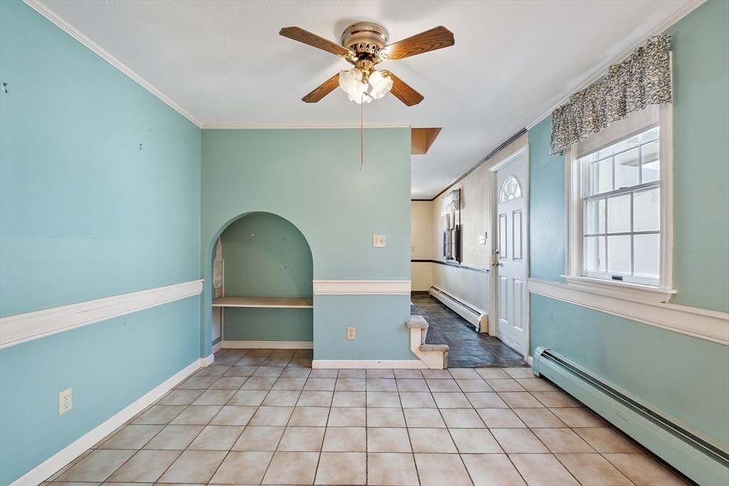 4 Moran Street Gardner, MA 01440 - Photo 14 of 30 a view of an empty room with window and chandelier fan