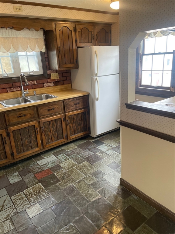 4 Moran Street Gardner, MA 01440 - Photo 23 of 30 a kitchen with stainless steel appliances granite countertop a refrigerator a sink and white cabinets