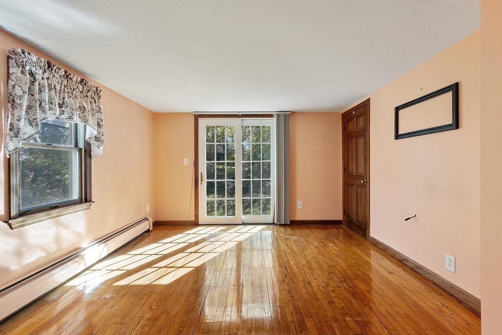 4 Moran Street Gardner, MA 01440 - Photo 9 of 30 a view of an empty room with wooden floor and a window