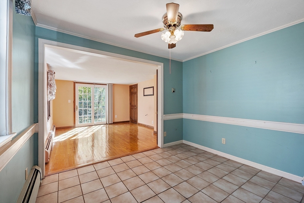 4 Moran Street Gardner, MA 01440 - Photo 10 of 30 an empty room with chandelier fan and windows