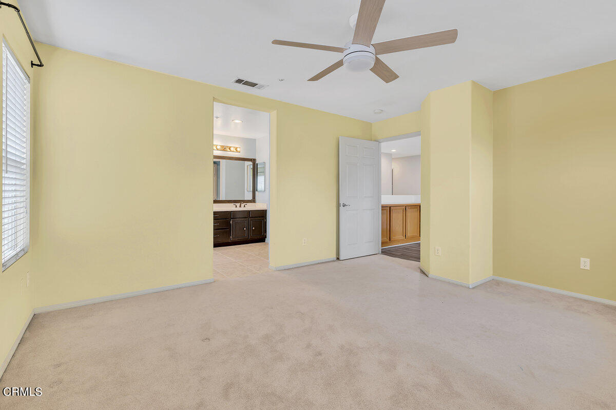 825 Noontide Way Oxnard, CA 93035 - Photo 15 of 26 a view of empty room with wooden floor and cabinet