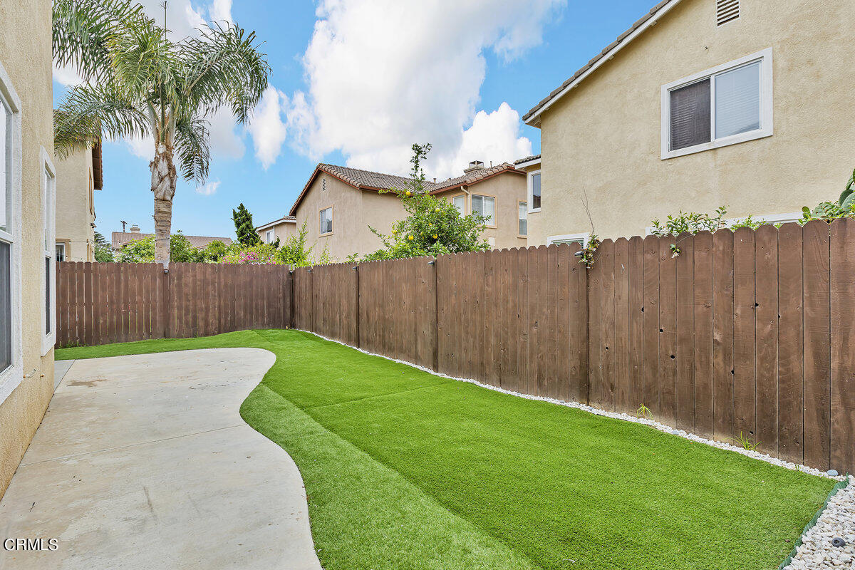 825 Noontide Way Oxnard, CA 93035 - Photo 22 of 26 a view of backyard with wooden fence