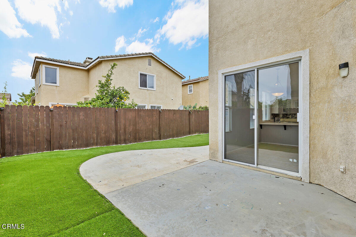 825 Noontide Way Oxnard, CA 93035 - Photo 23 of 26 a view of backyard of house with wooden fence