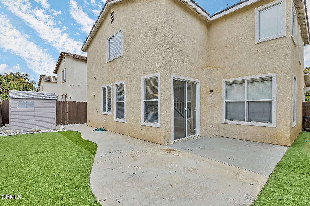 825 Noontide Way Oxnard, CA 93035 - Photo 25 of 26 a view of a house with a backyard