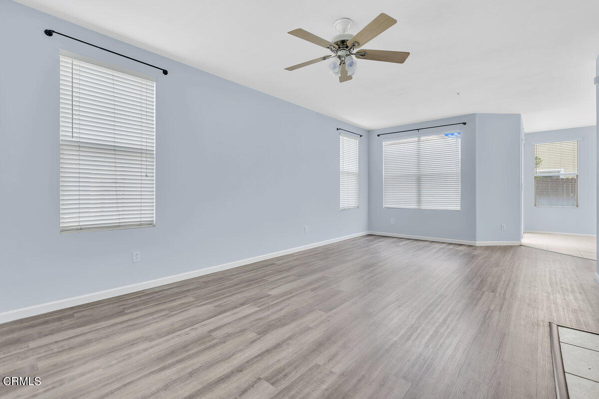 825 Noontide Way Oxnard, CA 93035 - Photo 3 of 26 wooden floor in an empty room with a window