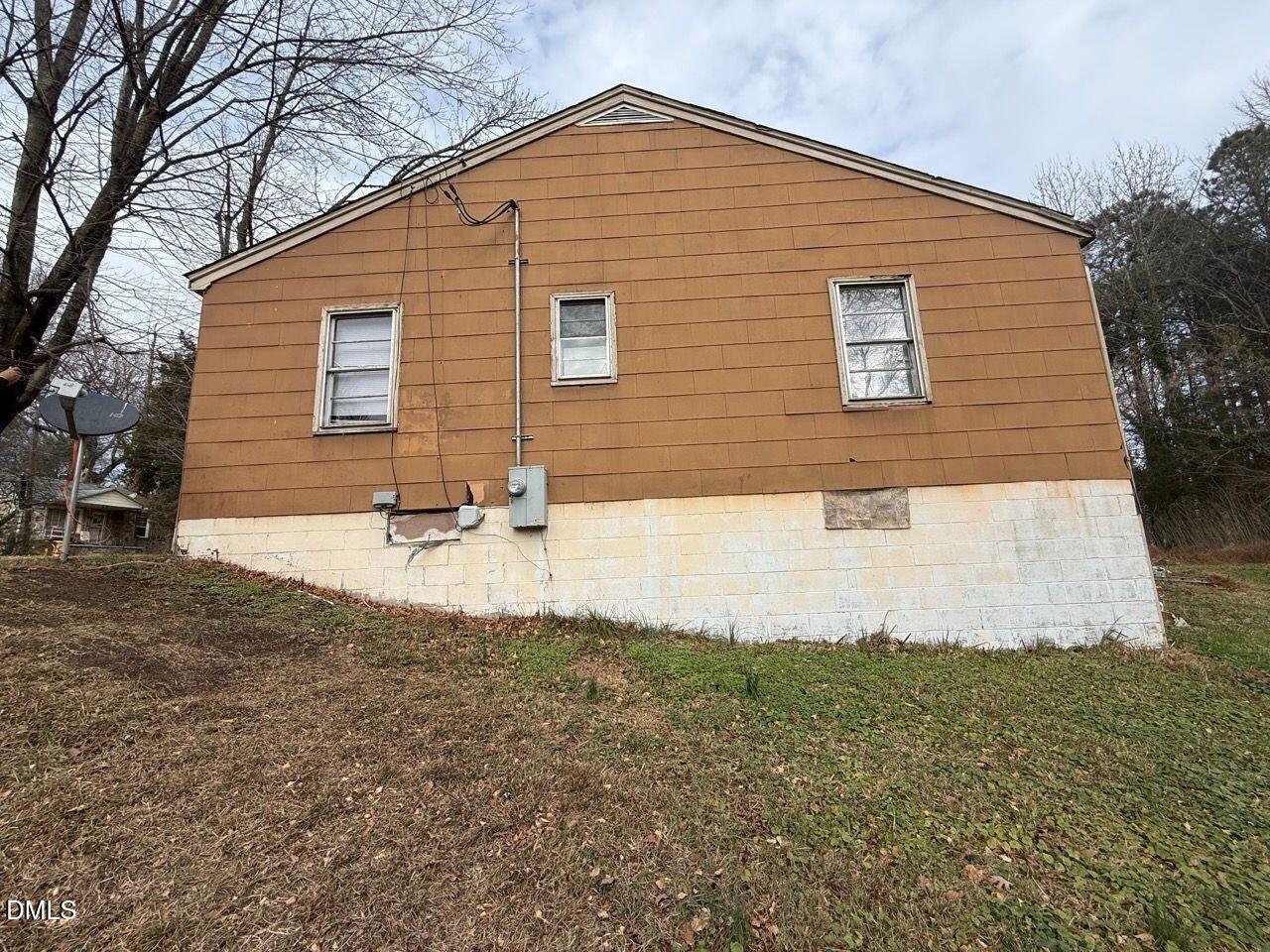 508 Jones Street Roxboro, NC 27573 - Photo 5 of 6 a view of a house with a yard