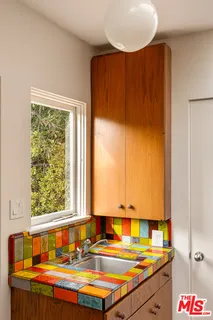 a bathroom with a sink and a window