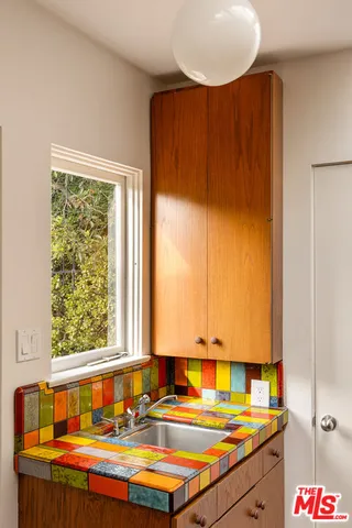 a bathroom with a sink and a window