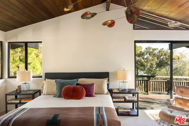 a bedroom with a bed and a table