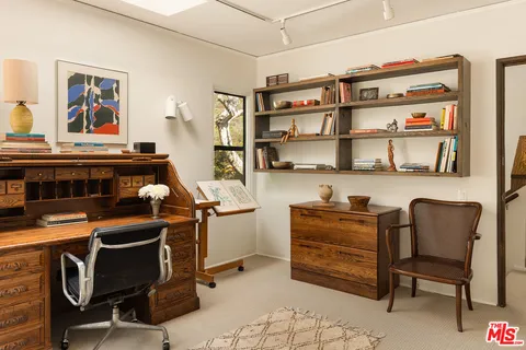 a room with furniture cabinets and window