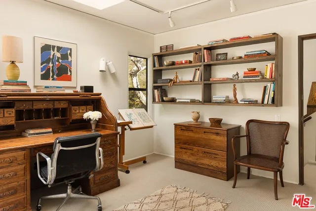 a room with furniture cabinets and window