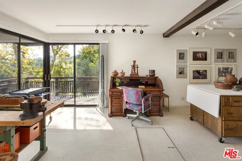 a room with gym equipment and a large window