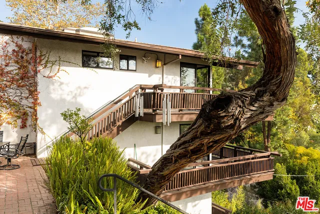 a view of balcony with furniture