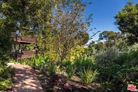 a view of a chairs and table in the patio
