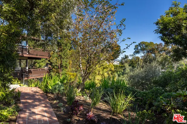 a view of a chairs and table in the patio