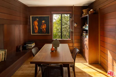 a view of a dining room with furniture window and outside view