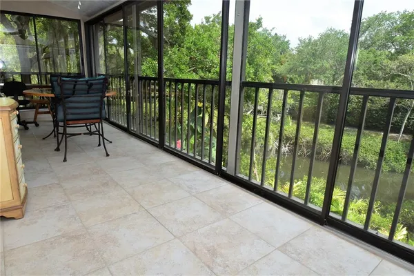 a view of a two chairs in the balcony