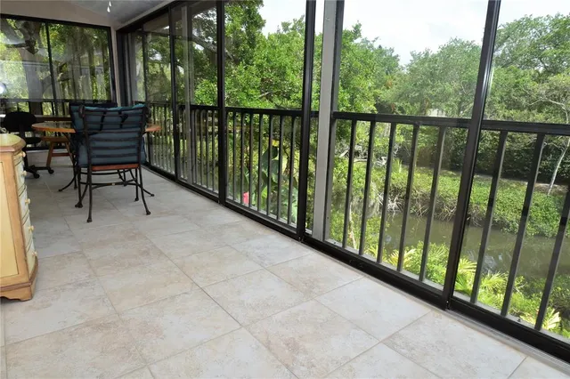 a view of a two chairs in the balcony