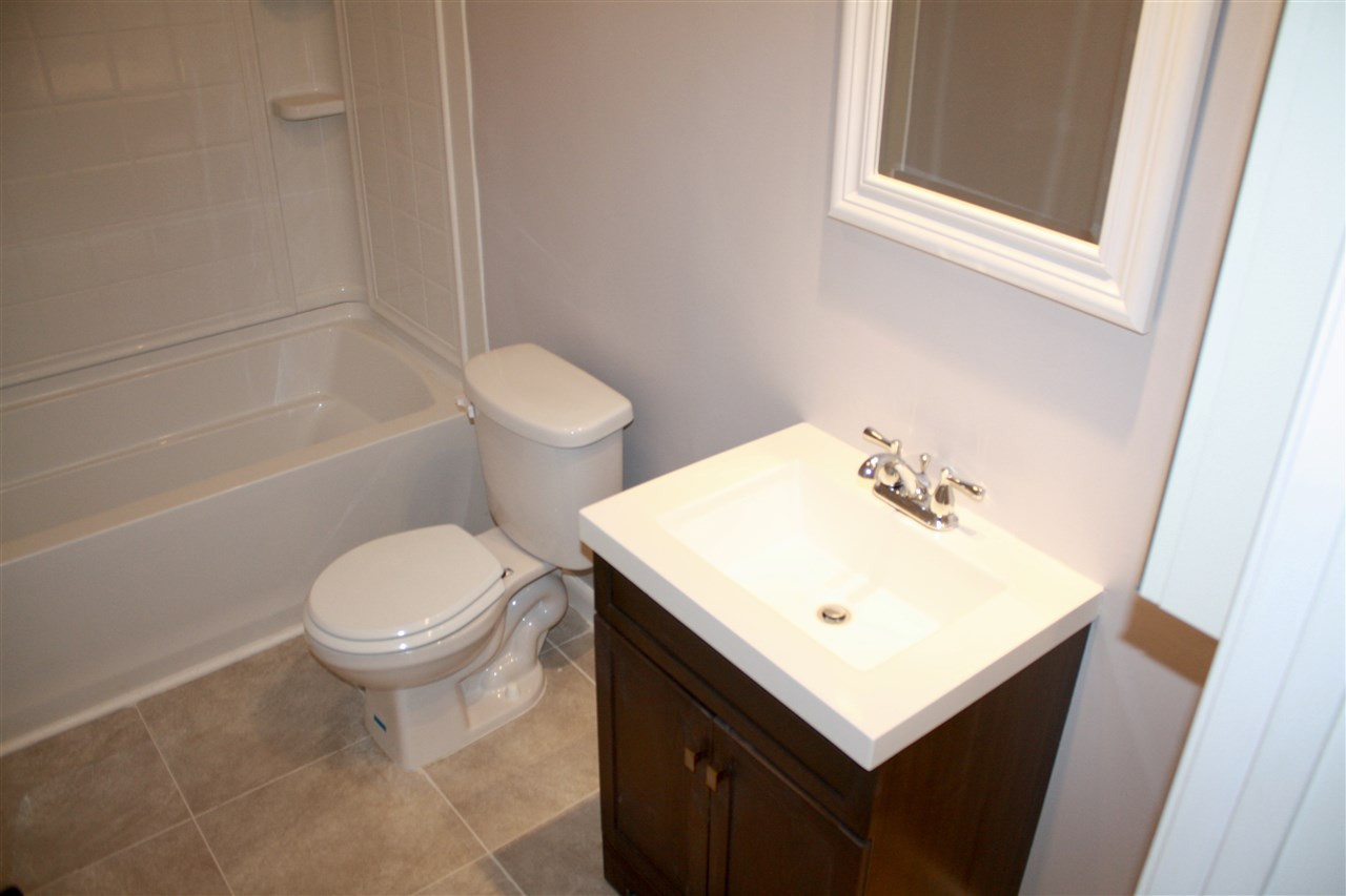 7006 Matthews Road Durham, NC 27712 - Photo 16 of 25 Guest bathroom is updated and crisp
