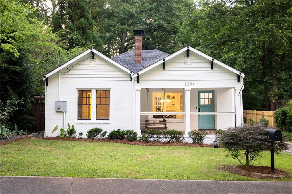 2204 Ridgedale Road Northeast Atlanta, GA 30317 - Photo 1 of 1 a front view of a house with a yard