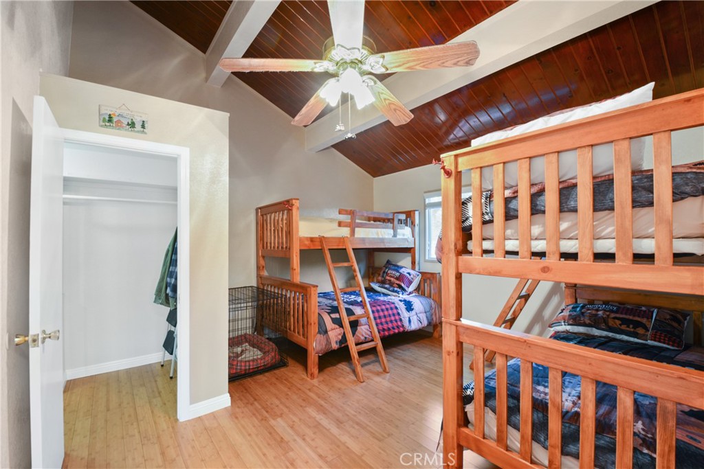 1942 Wilderness Road Running Springs, CA 92382 - Photo 17 of 20 a view of a room with wooden floor and furniture