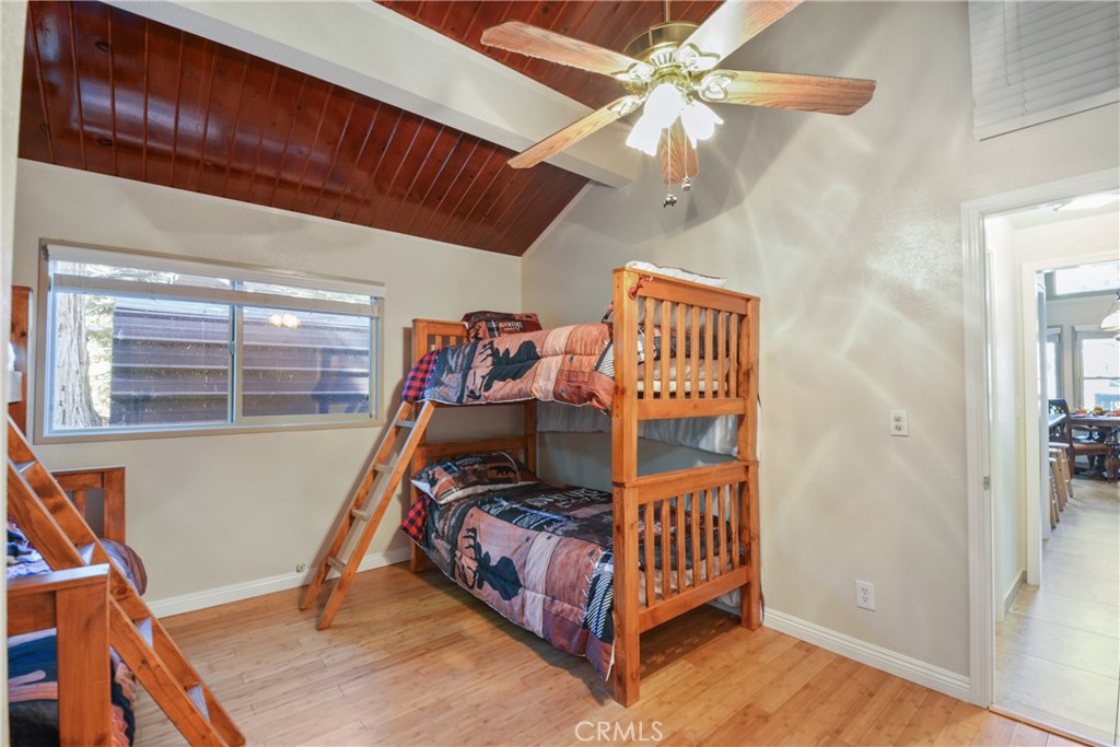 1942 Wilderness Road Running Springs, CA 92382 - Photo 18 of 20 a bedroom with furniture and a window