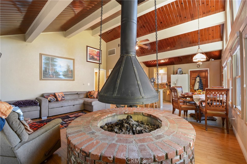 1942 Wilderness Road Running Springs, CA 92382 - Photo 20 of 20 a living room with furniture and a wooden floor