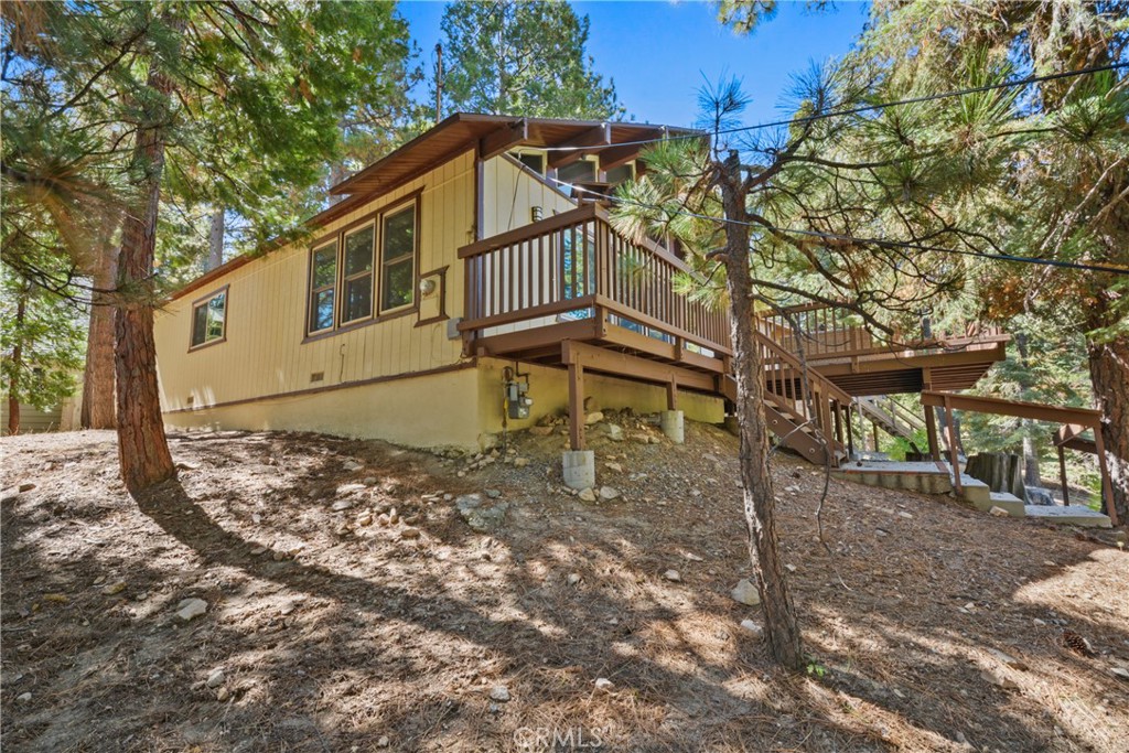 1942 Wilderness Road Running Springs, CA 92382 - Photo 7 of 20 a view of a house with a yard