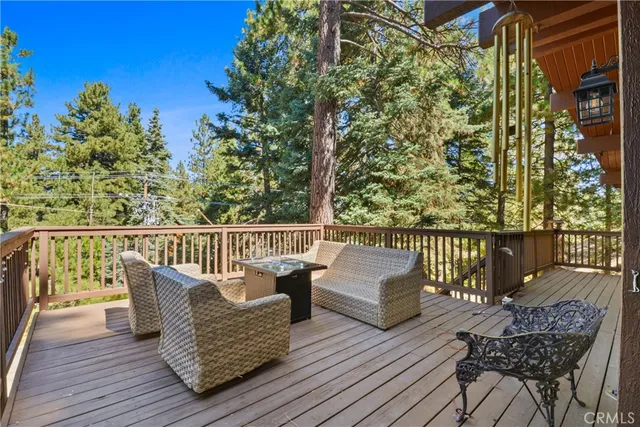 a view of balcony with furniture and wooden floor