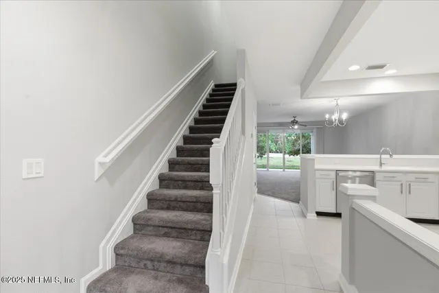 a view of entryway and kitchen