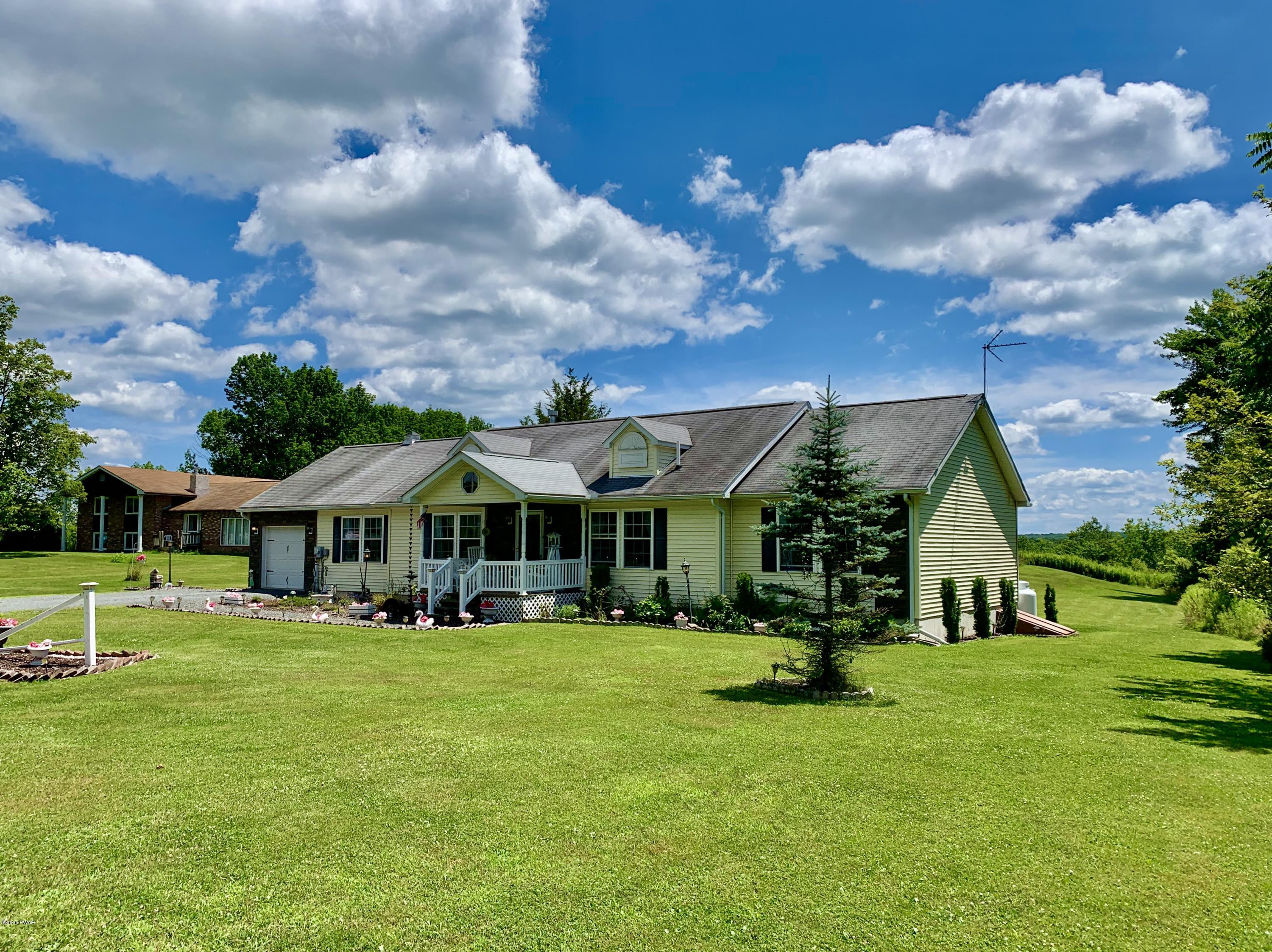 678 Stock Farm Road Lake Ariel, PA 18436 - Photo 1 of 41 a front view of a house with a yard