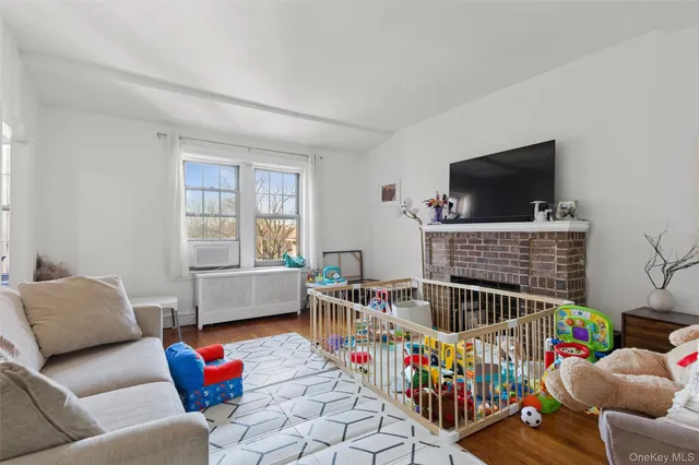 a kitchen with a stove a refrigerator and a wooden cabinets