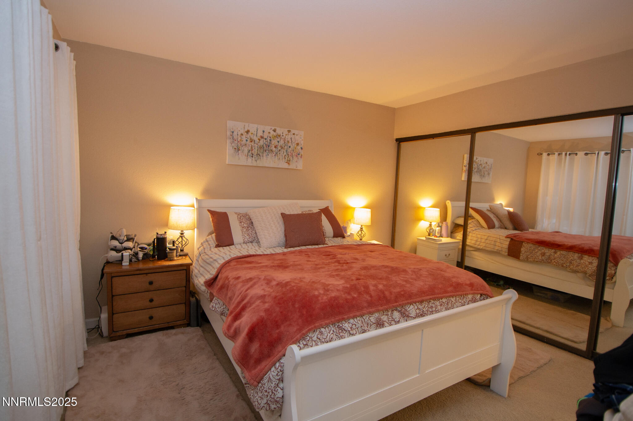 2127 Roundhouse Road Sparks, NV 89431 - Photo 12 of 20 a spacious bedroom with a bed and wooden floor