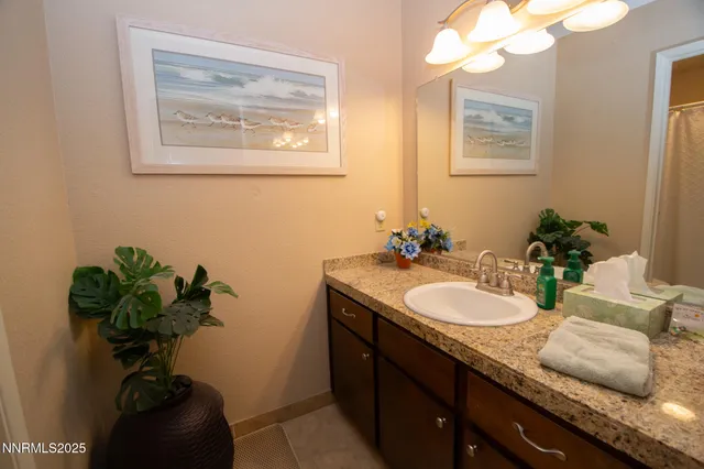 a bathroom with a sink a vanity and a mirror